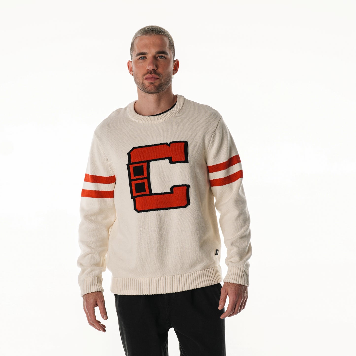 Front: Cream sweater, Hurricanes Collegiate "C" on front, red stripes on sleeves
