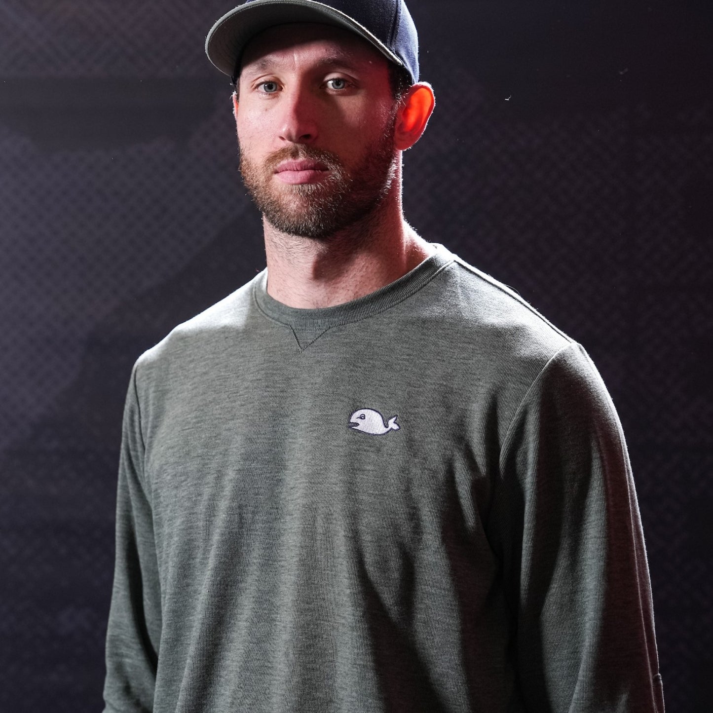 Ollive green sweater, Pucky logo on left chest, worn by Jaccob Slavin in photo