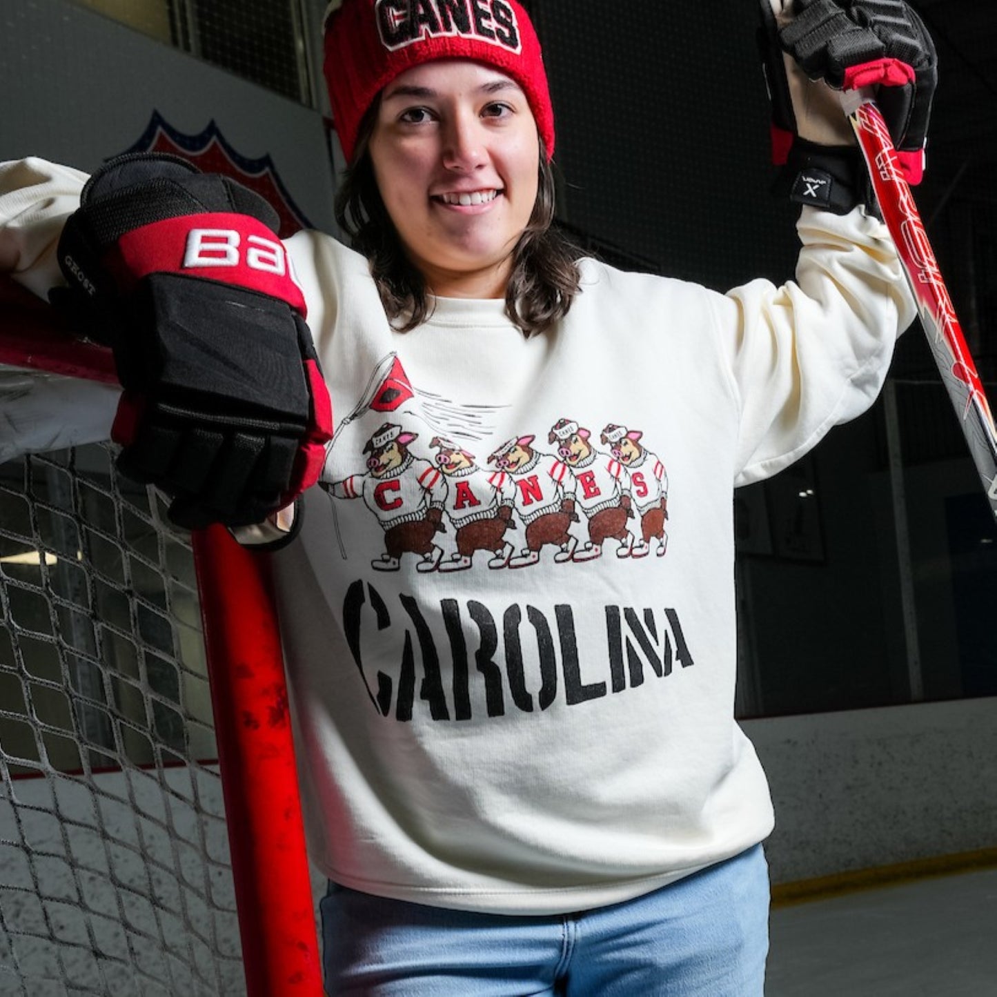 The crewneck being worn by a model on an ice rink