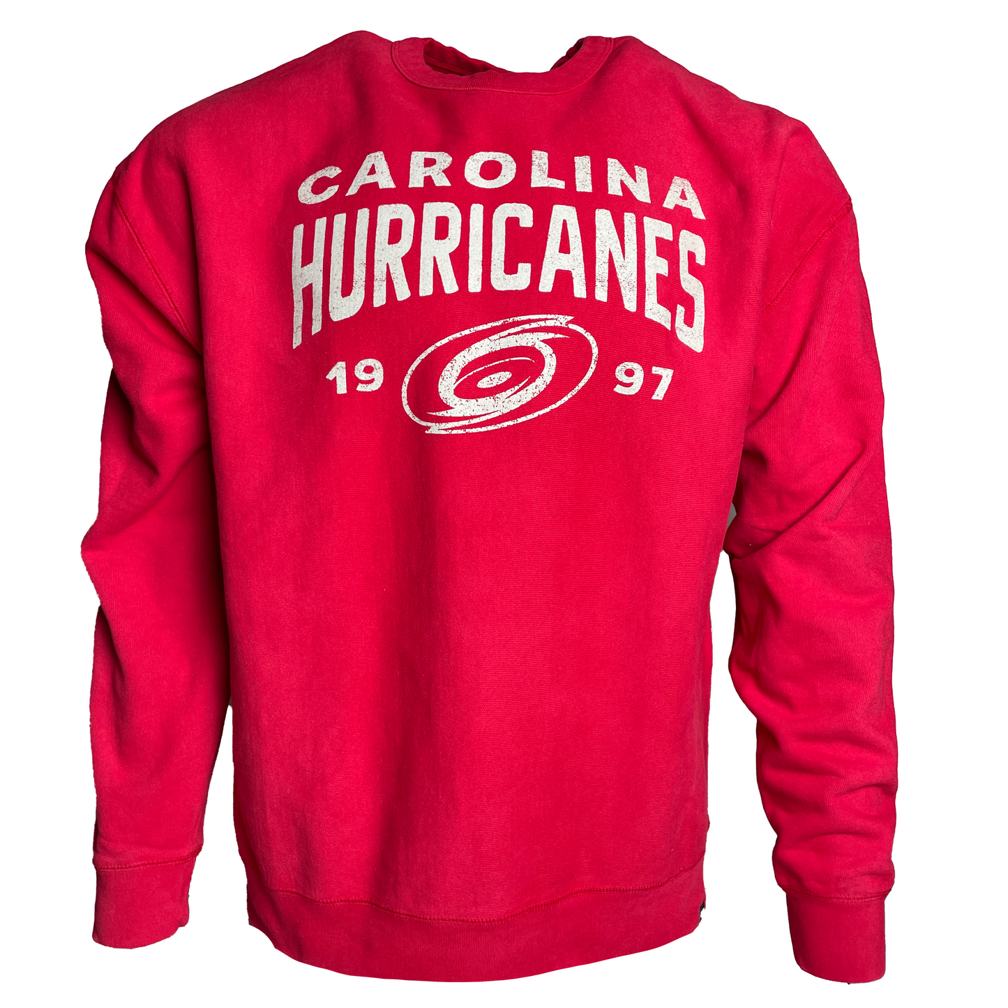 Red sweater, says Carolina Hurricanes 1997 with primary logo in white