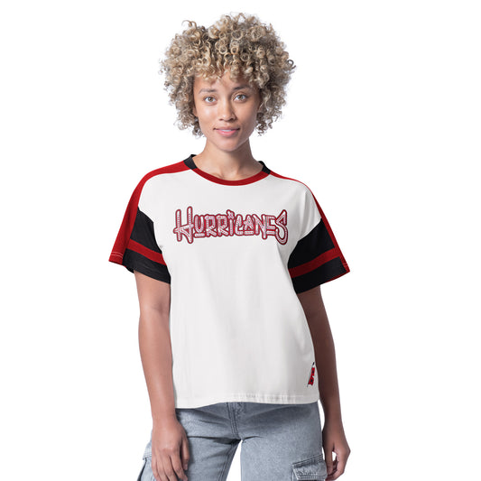 Front: White tee with red/black trim, "Hurricanes" across chest, Flags logo at left hip