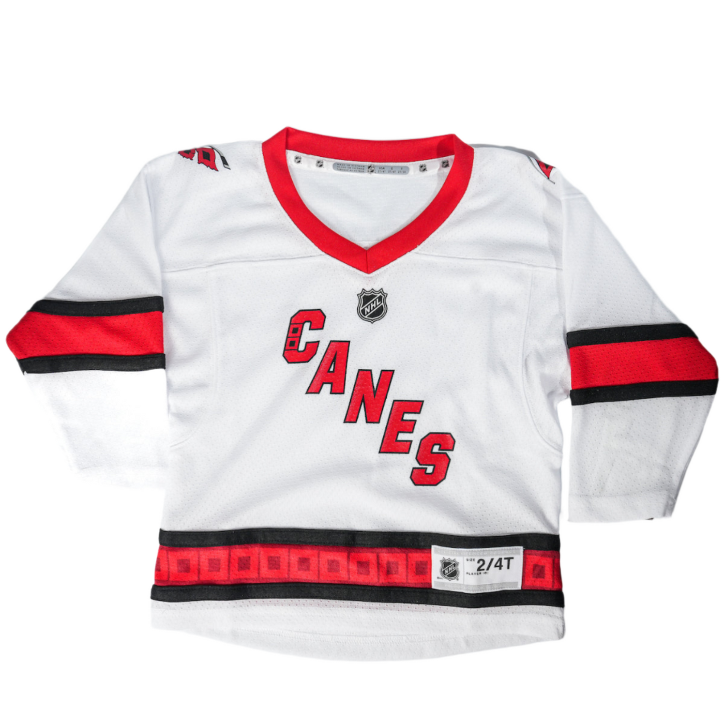 White jersey with red and black trim, Canes diagonal logo across chest