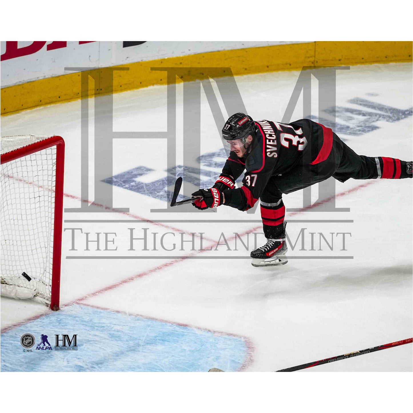Photo of Andrei Svechnikov shooting during a home game