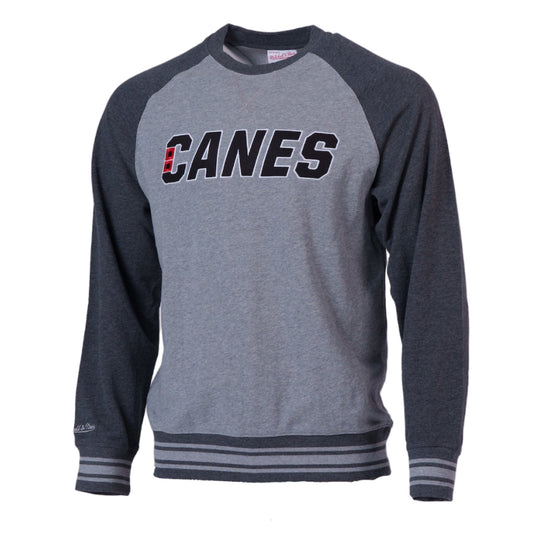 Light gray crewneck with dark gray sleeves, "CANES" wordmark across chest