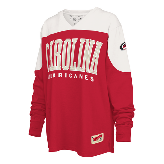 Front: Red sweater with white shoulders, "CAROLINA HURRICANES" in white on front