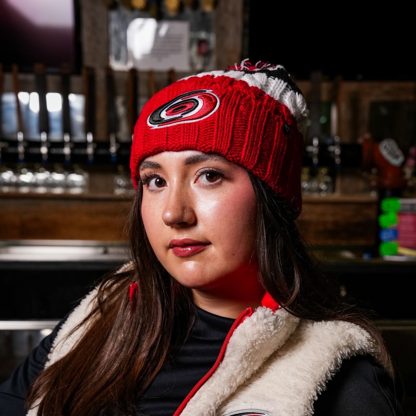 A model posing while wearing the beanie