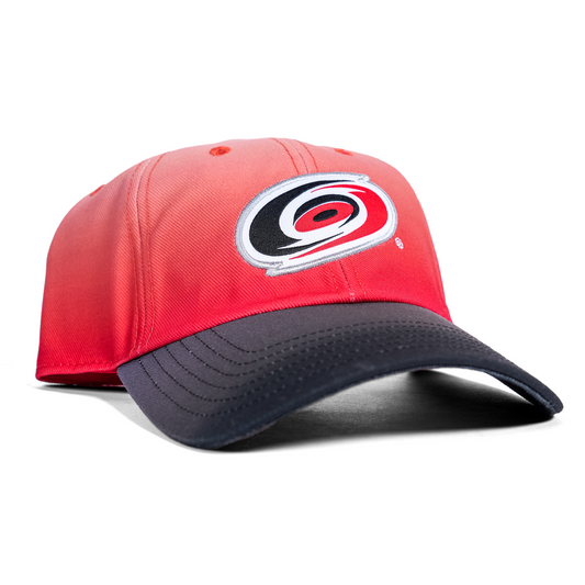 Faded red hat with black brim, Hurricanes primary logo on front