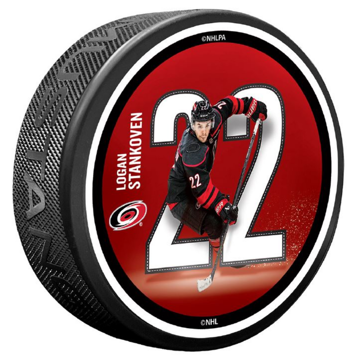 Red puck with picture of Logan Stankoven in front of his number 22