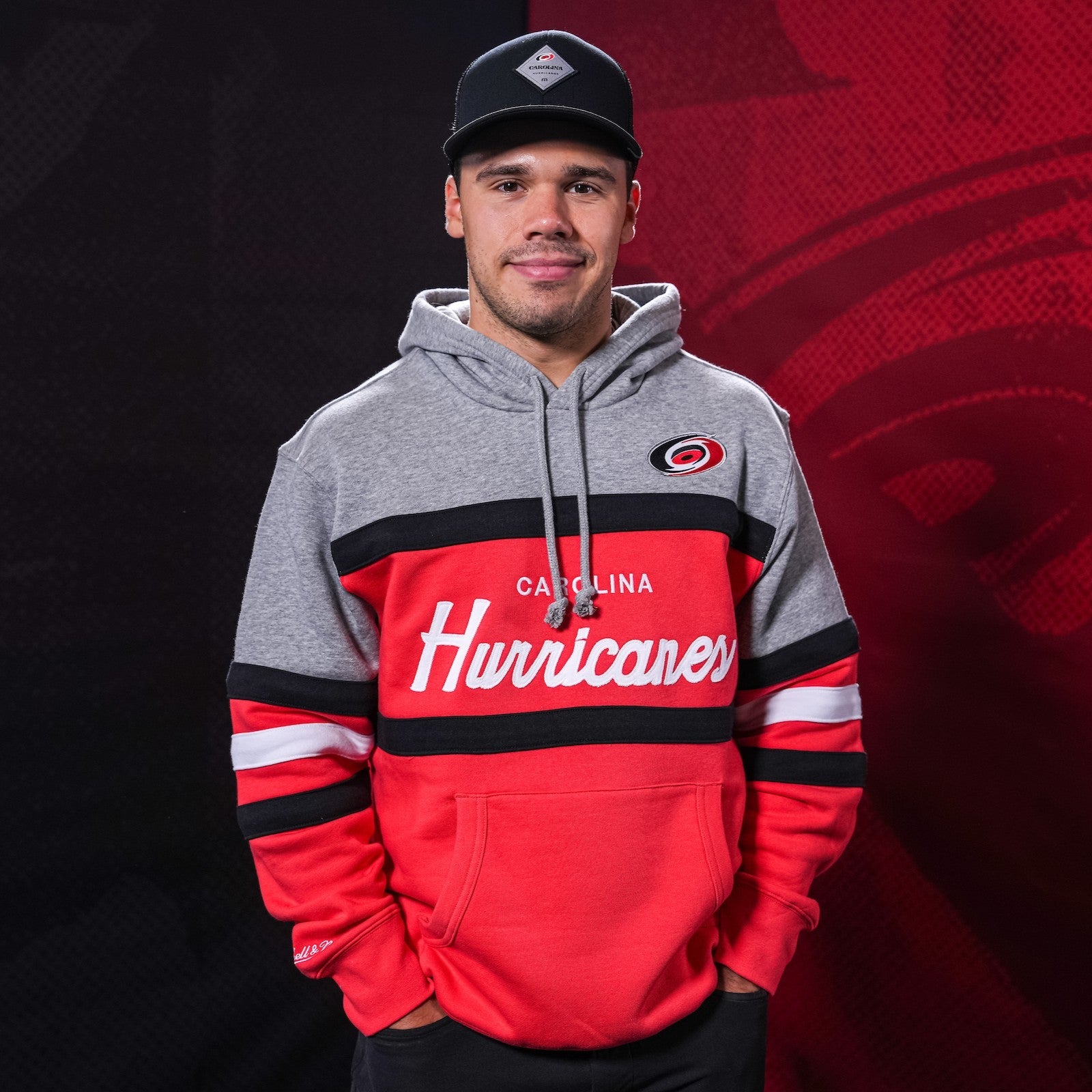 Hurricanes forward Logan Stankoven wearing Hurricanes merchandise
