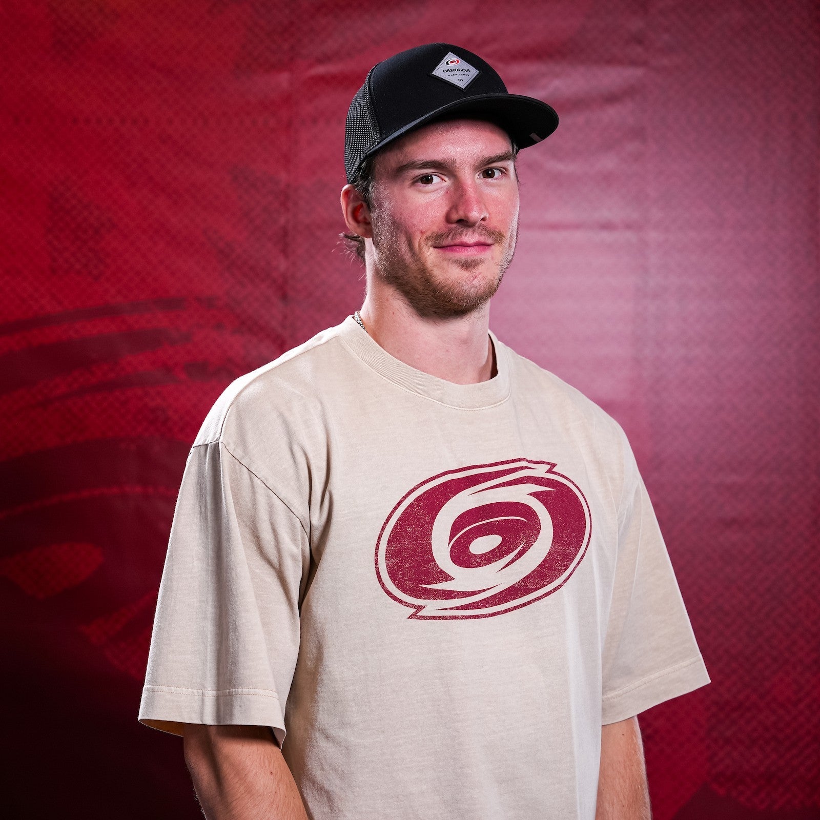 Hurricanes forward Andrei Svechnikov wearing Hurricanes merchandise