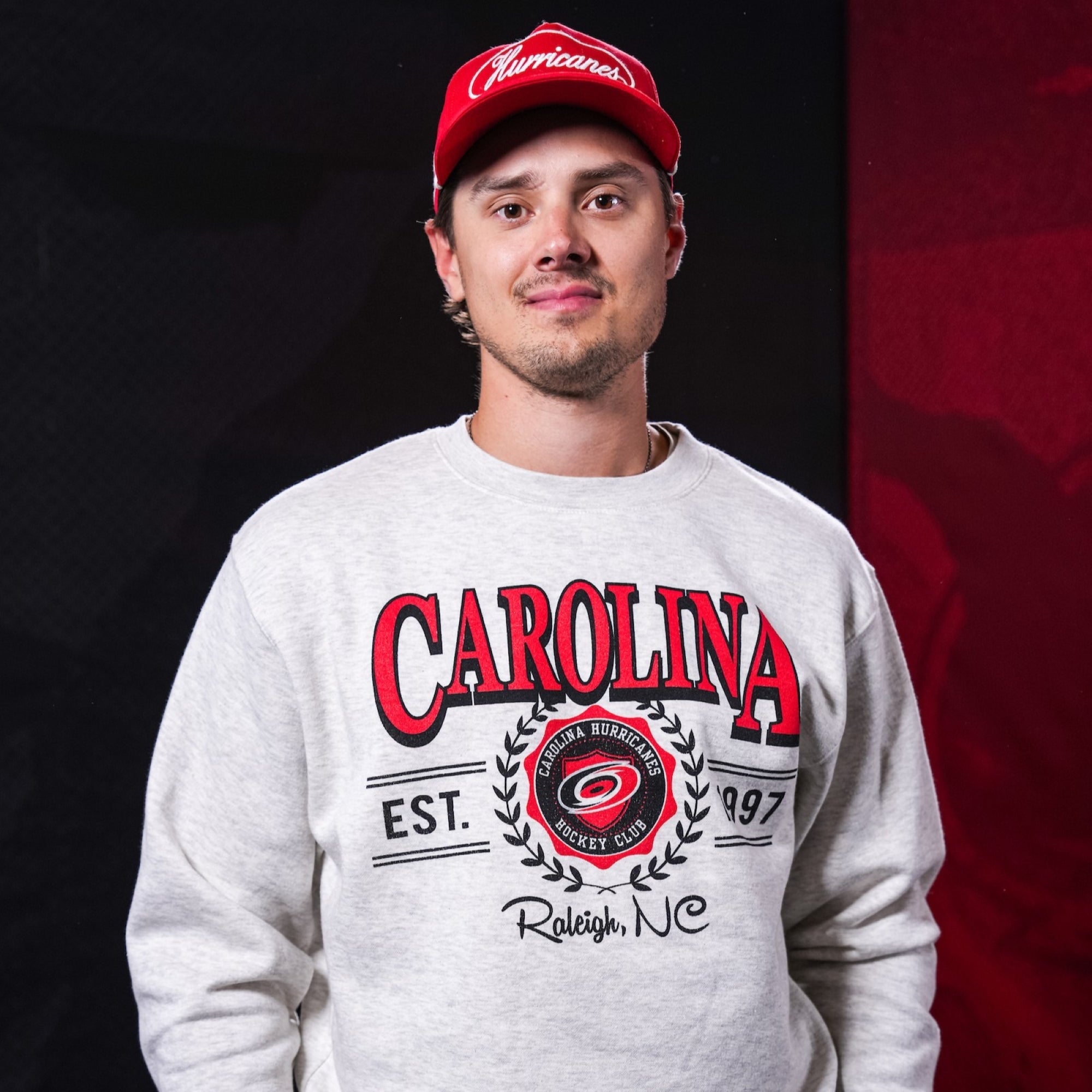 Hurricanes forward Sebastian Aho wearing Hurricanes merchandise