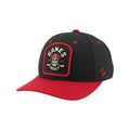 Front Left: Black hat, red brim, tombstone-shaped artwork on front