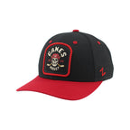 Front Left: Black hat, red brim, tombstone-shaped artwork on front