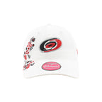 Front: Primary logo on front, red/black/white floral pattern to right of logo & on brim
