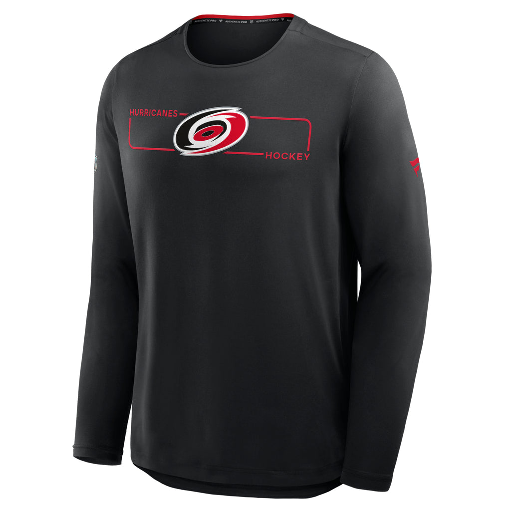 Front: Red rectangular outline across chest, says "CAROLINA HOCKEY" in shape, Primary logo overtop line