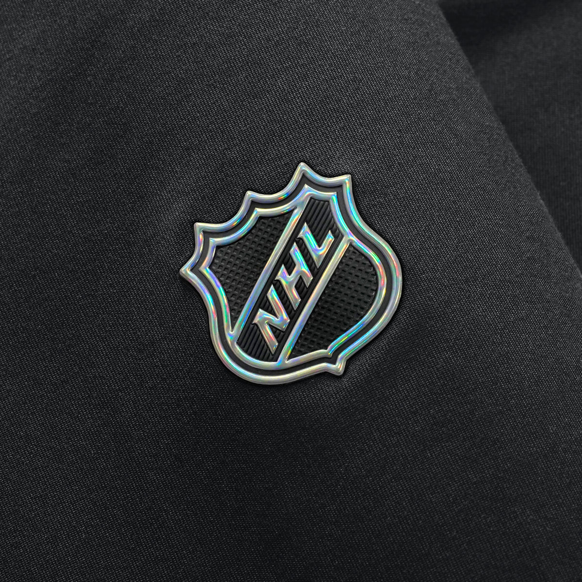 Close up of holographic & textured NHL Shield on right sleeve