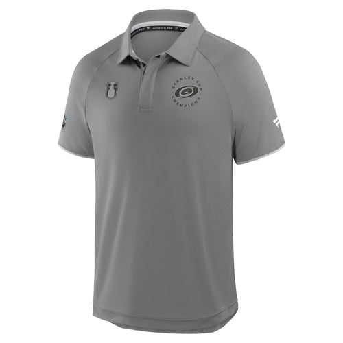 Front: Grey/black Primary logo on left chest, "STANLEY CUP CHAMPIONS" around logo, Cup logo right chest