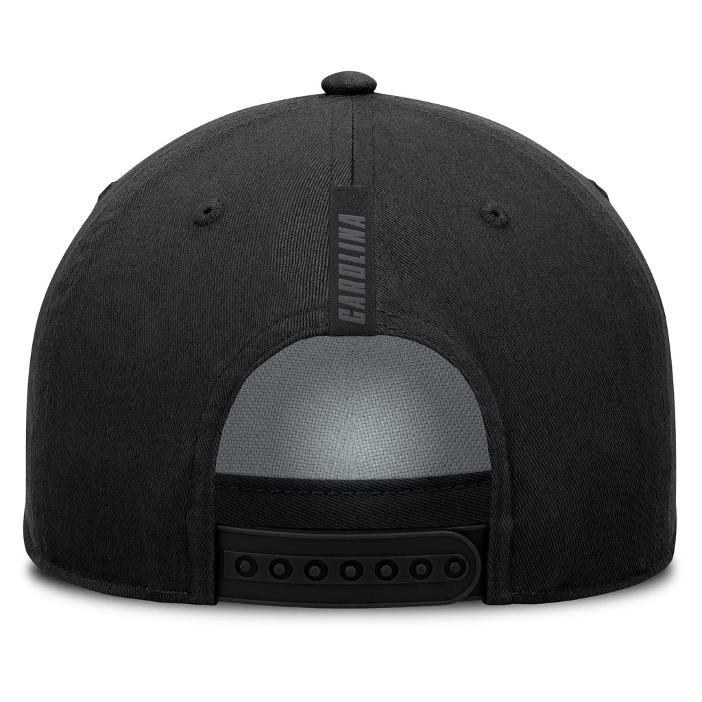 Back: Black hat with black snapback straps, "CAROLINA" vertically in black