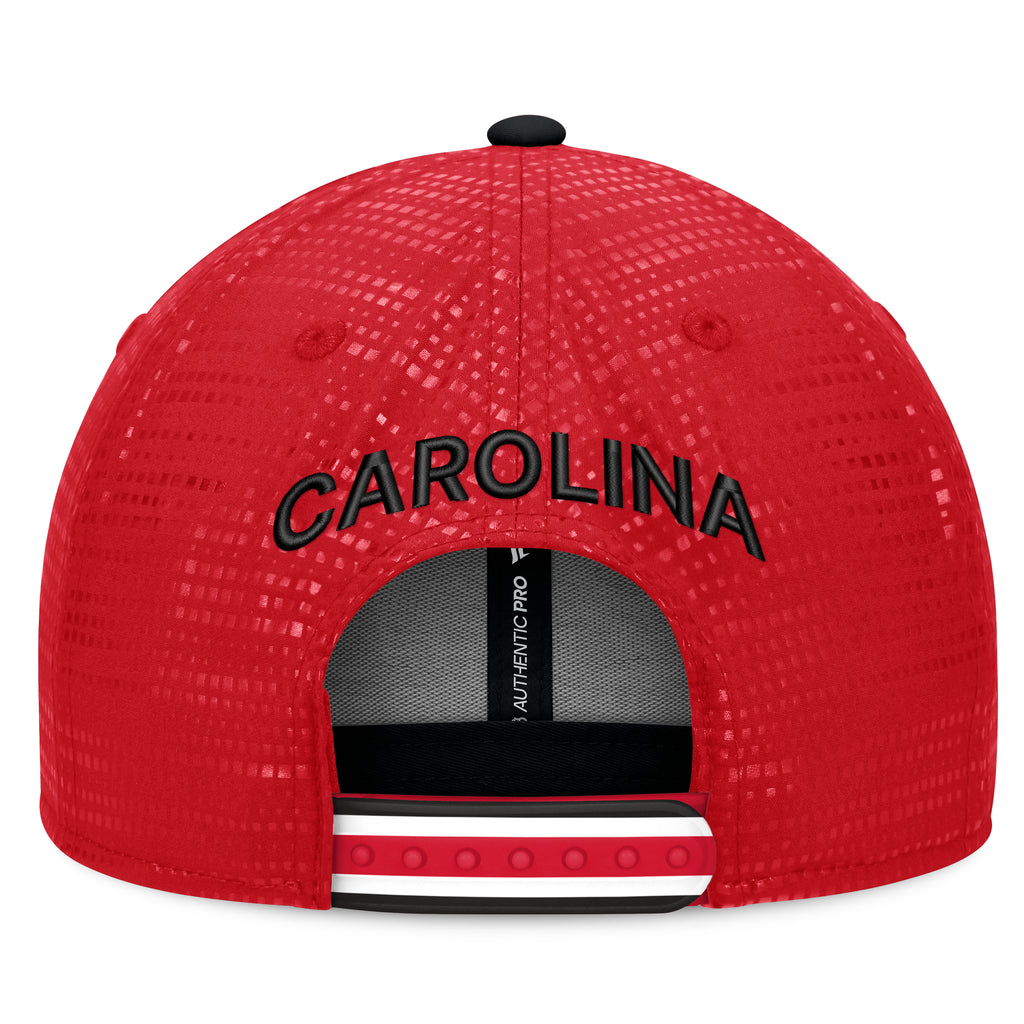 Back: Red/white/black-striped snapback straps, "CAROLINA" arched in black above straps