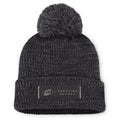 Front: Black cuffed acrylic beanie with grey pom, rectangular "CAROLINA HOCKEY" patch on cuff in black/beige