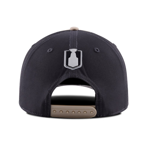 Back: Black back, biege crown, textured Stanley Cup logo above biege snapback straps