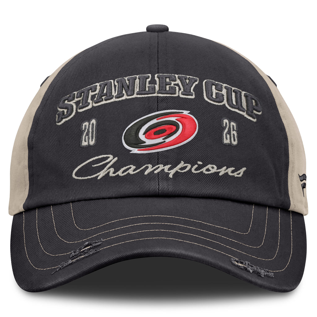 Front: Black hat, biege trim, rips on brim, "2026 Stanley Cup Champions" with Primary logo