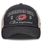 Front: Black hat, biege trim, rips on brim, "2026 Stanley Cup Champions" with Primary logo