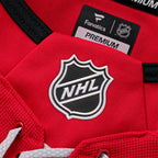 Close up of the NHL holographic shield on the front neckline