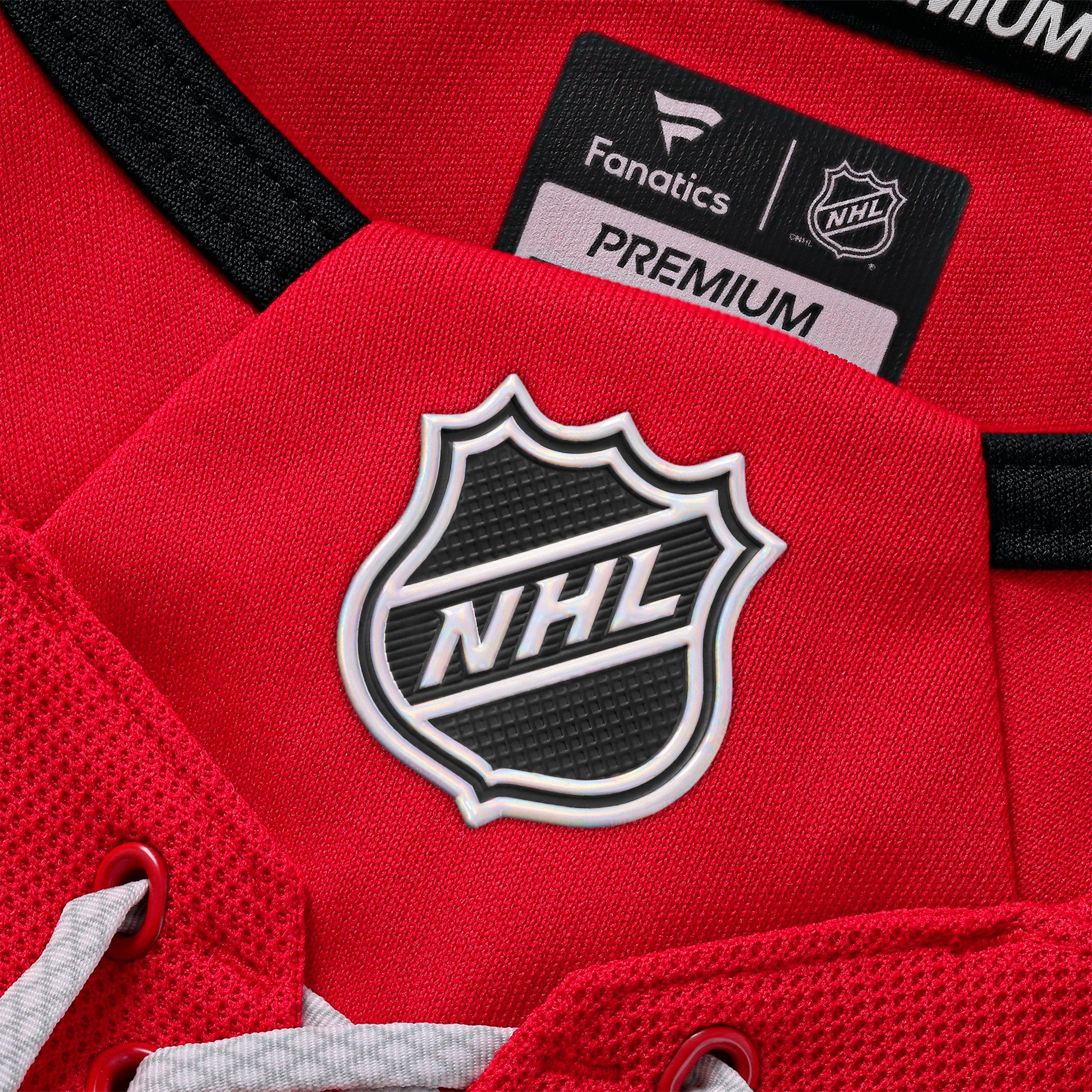 Close up of the NHL holographic shield on the front neckline