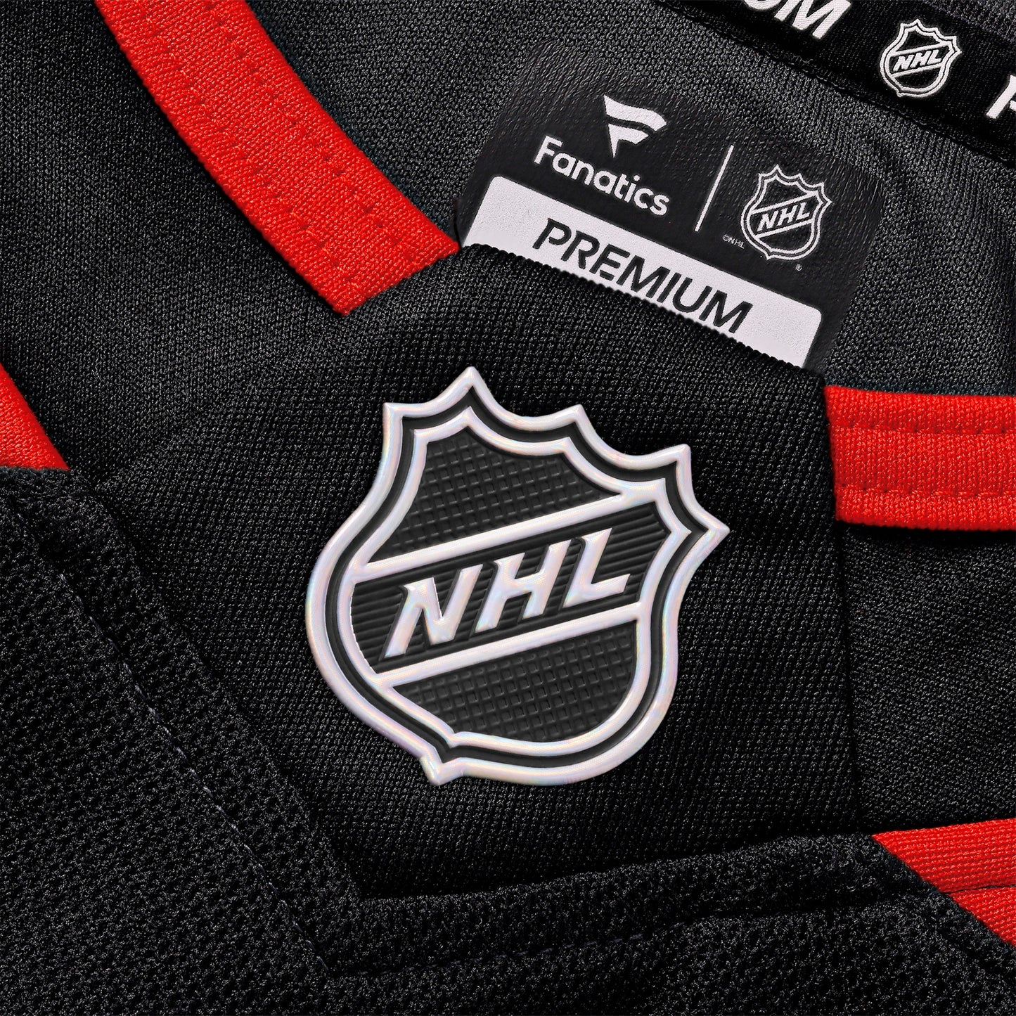 Close up of the NHL holographic shield at the front neckline