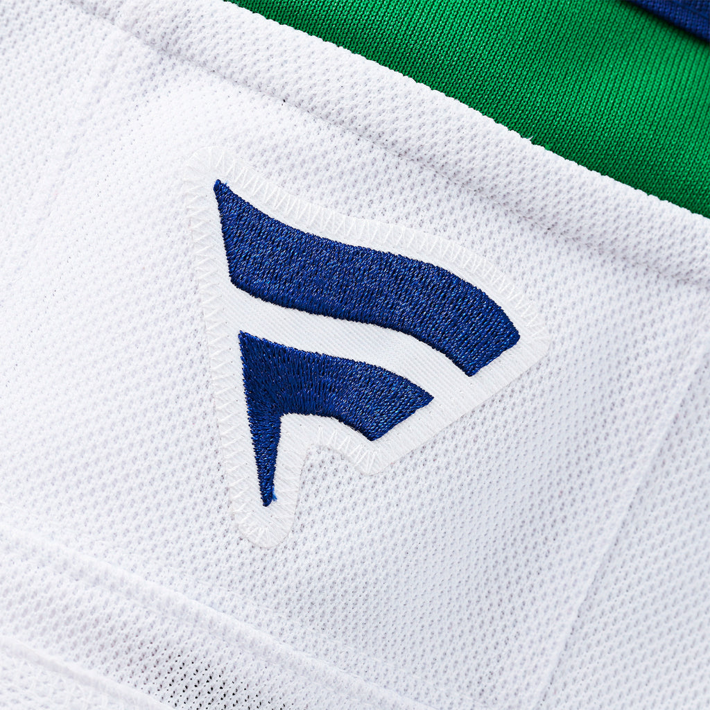 Close up of the blue Fanatics logo at the neckline on back