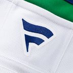 Close up of the blue Fanatics logo at the neckline on back