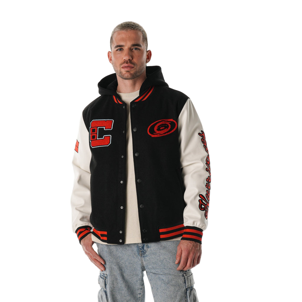 Front: Black varsity jacket with white sleeves, "C" on right chest, Tonal logo on left
