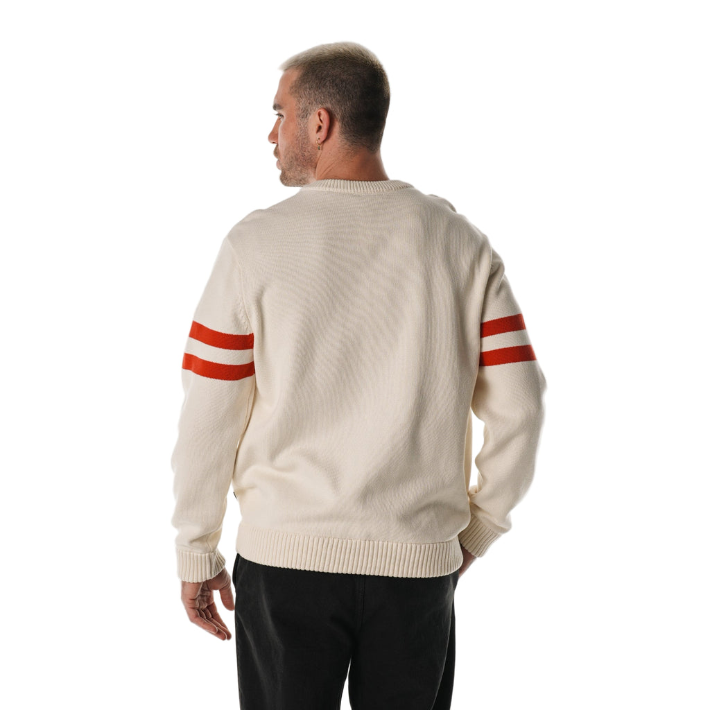 Back: Cream sweater, red stripes on sleeves
