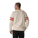 Back: Cream sweater, red stripes on sleeves