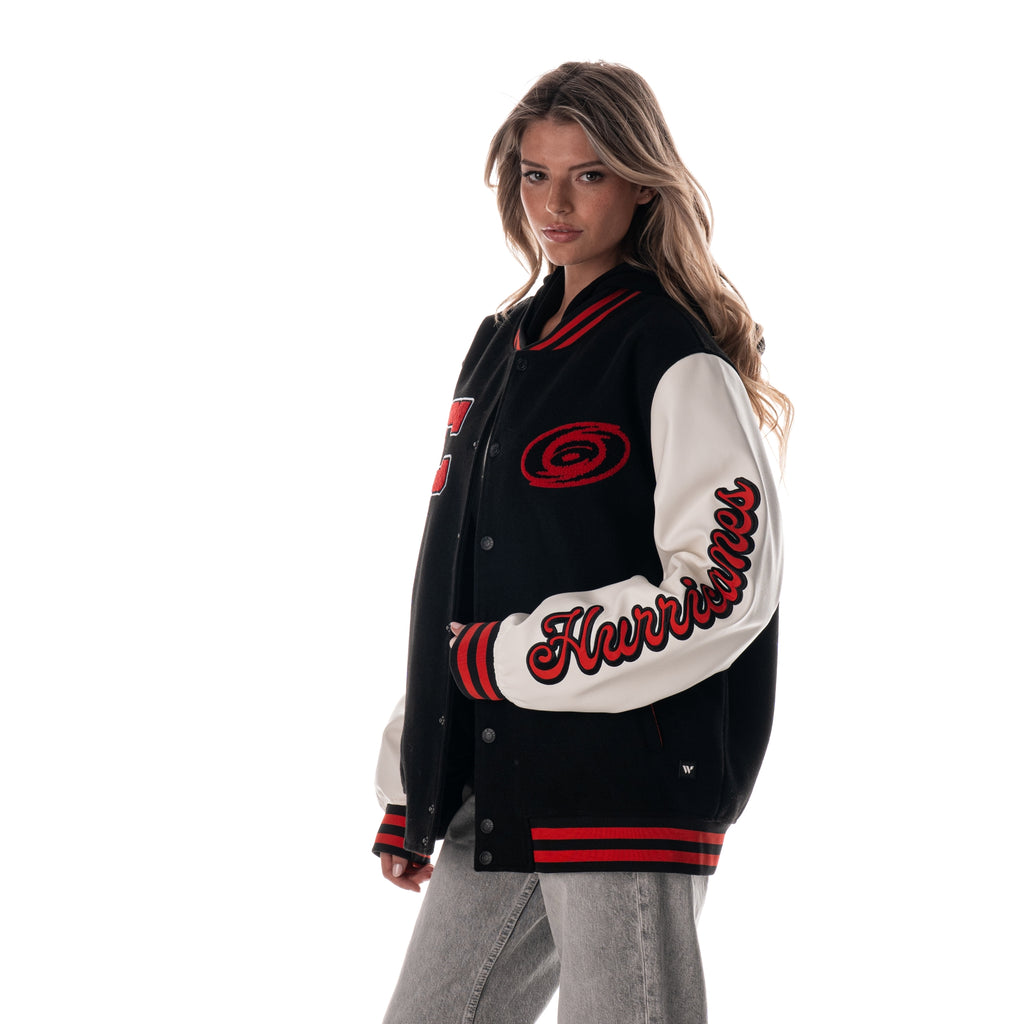 Left: "Hurricanes" in red and black in script down left sleeve