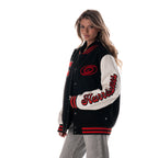 Left: "Hurricanes" in red and black in script down left sleeve