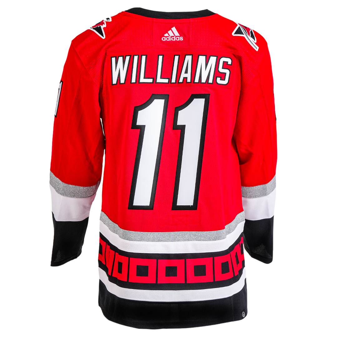 Back: Hurricanes Red Anniversary jersey with Williams 11 on back 