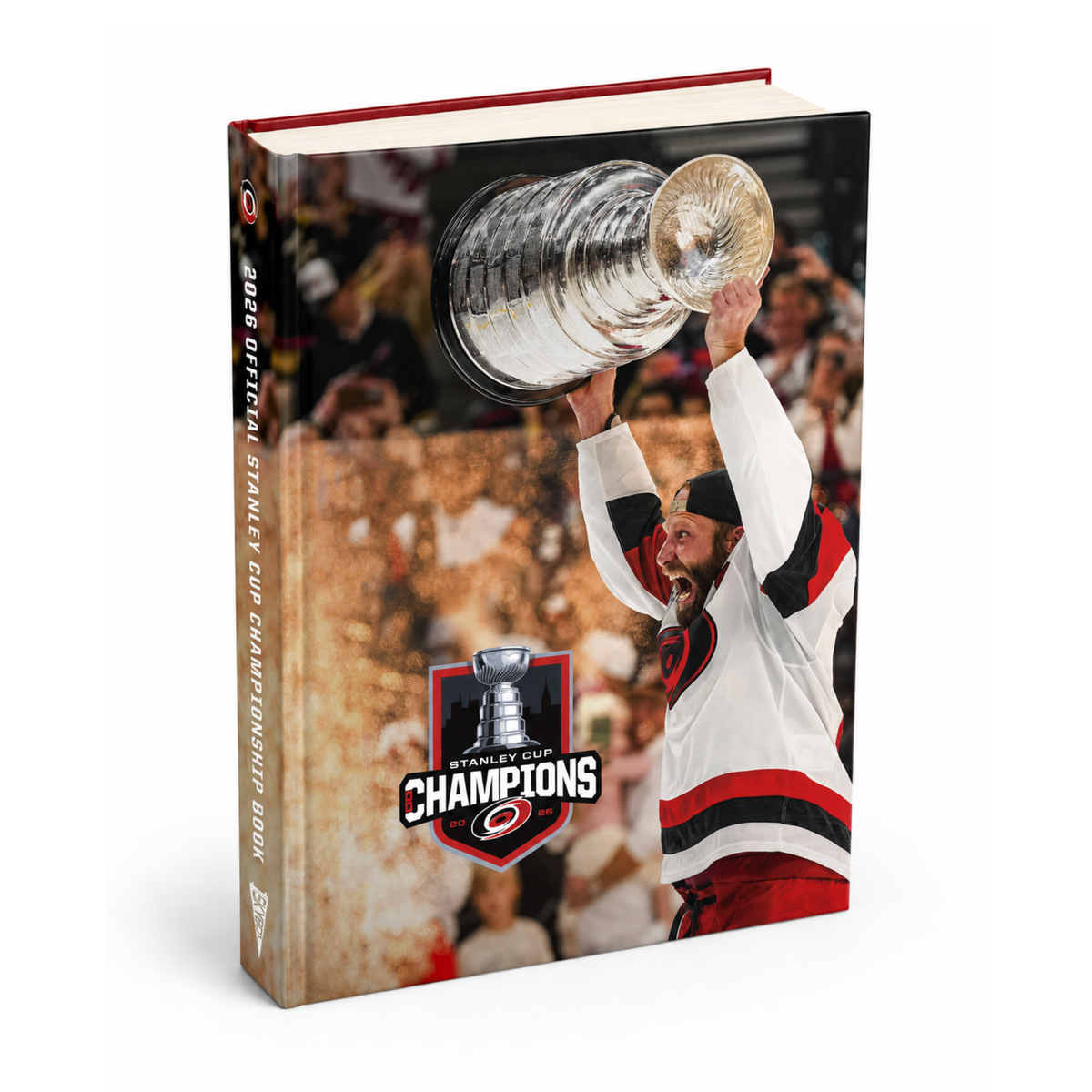 Book standing up; cover with Jordan Staal lifting Stanley Cup, 2026 SCC in-house Logo