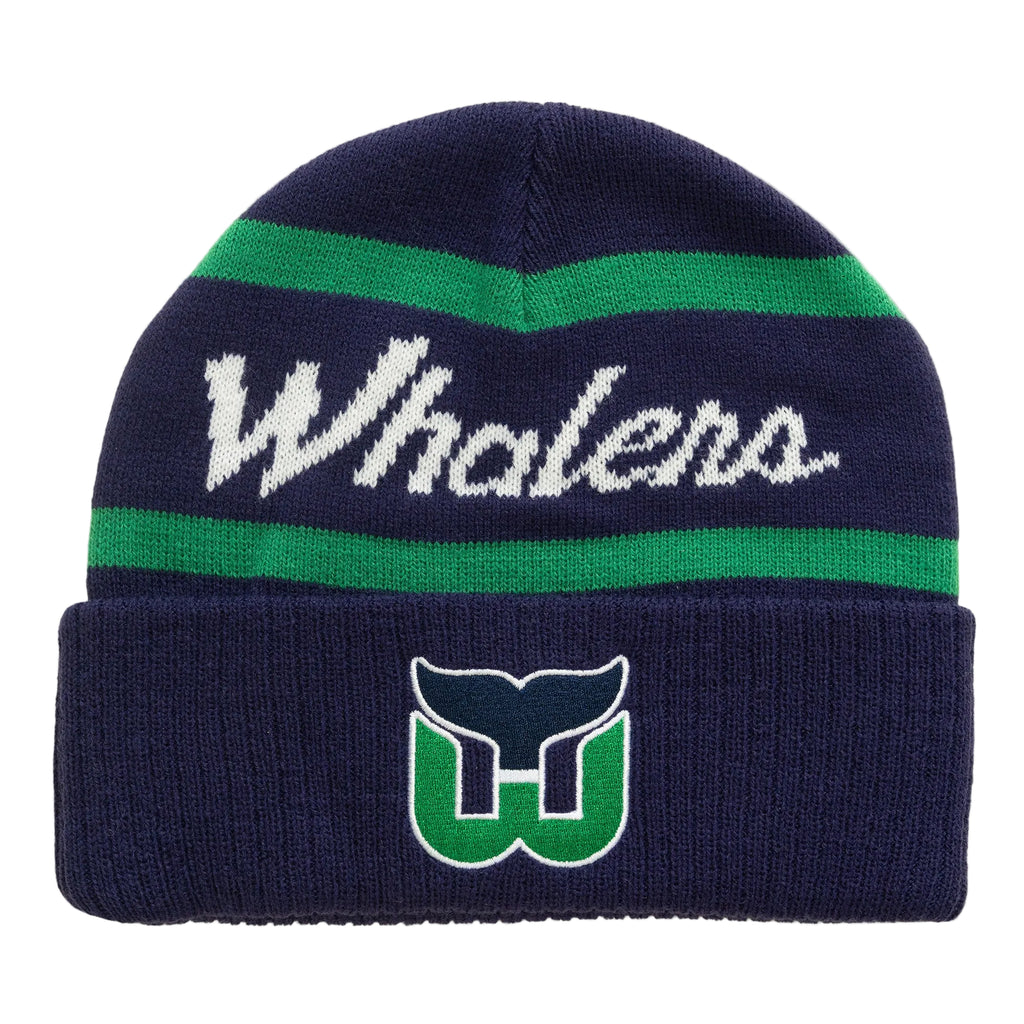 Front: Navy blue cuffed beanie, "Whalers" in cursive white with green stripes above/below, Tail logo on cuff