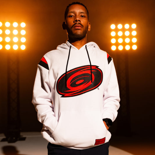 White hoodie, black strings, red/black stripe at shoulders, Tonal logo across front