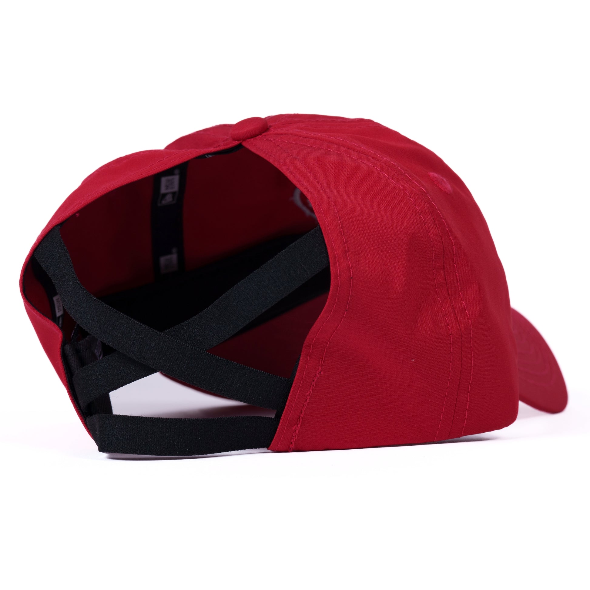 Back: Red hat, opening in back with black strings to hold ponytail