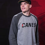 The crewneck being worn by Hurricanes defenseman Alexander Nikishin