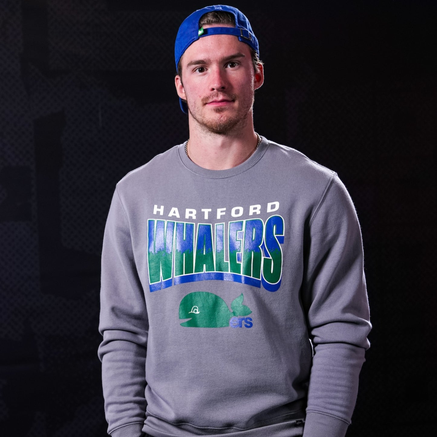 Grey crewneck being worn by Hurricanes forward Andrei Svechnikov