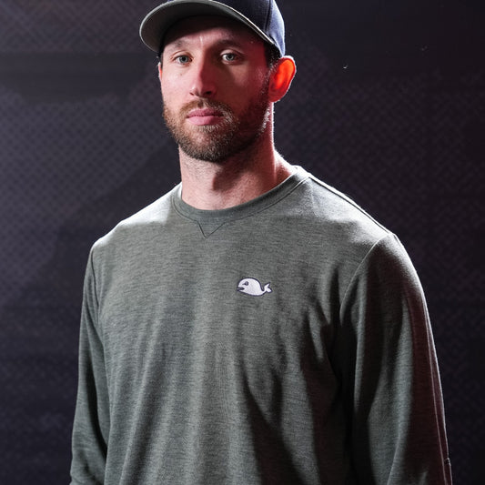 Ollive green sweater, Pucky logo on left chest, worn by Jaccob Slavin in photo