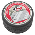 puck that says Carolina Hurricanes Military Appreciation with dog tag art
