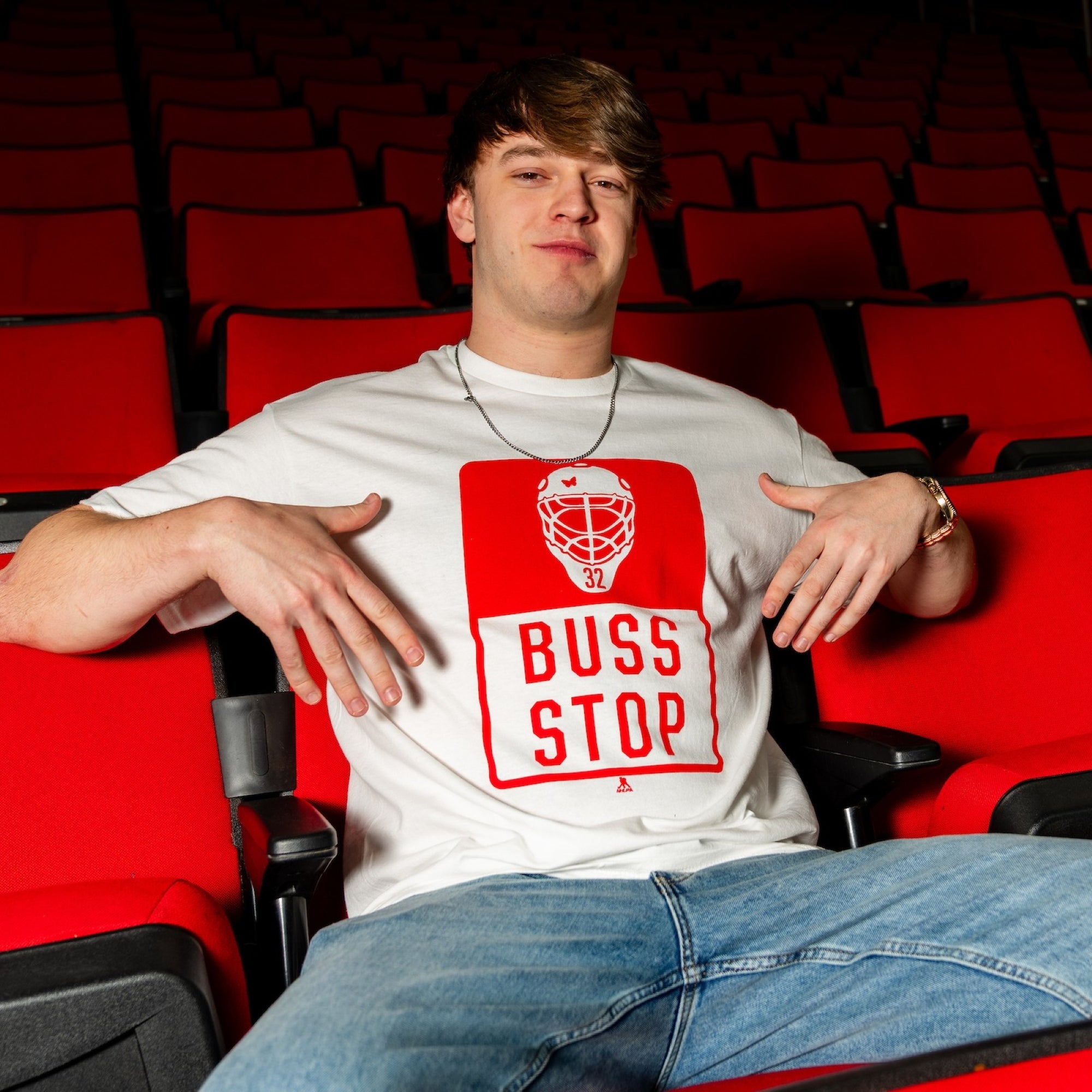 The tee being worn by a model in the seats of the Lenovo Center