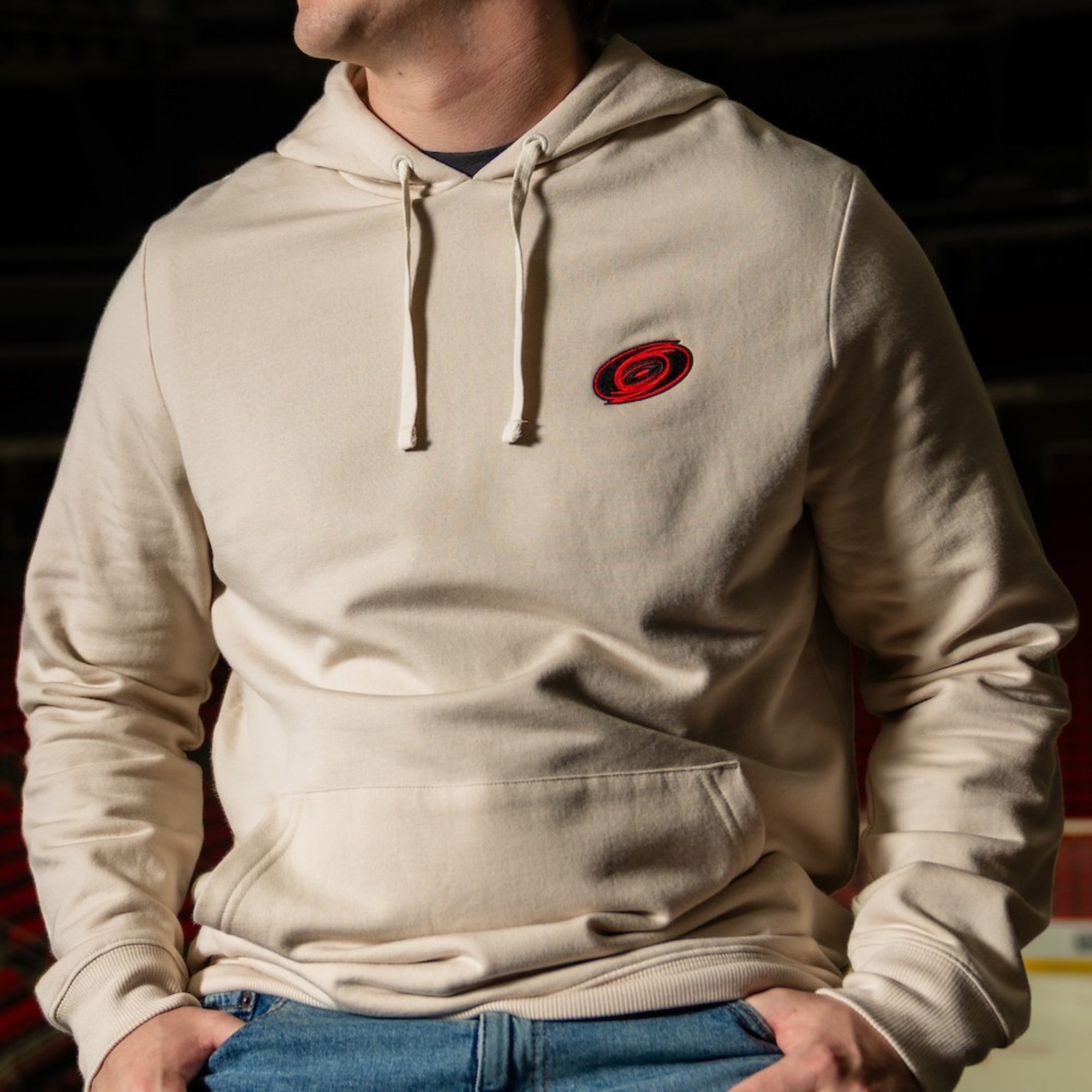 Cream pullover hoodie, strings at neckline, Tonal logo on left chest