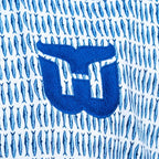 Close up of the Whalers Tail logo and the Sardine pattern