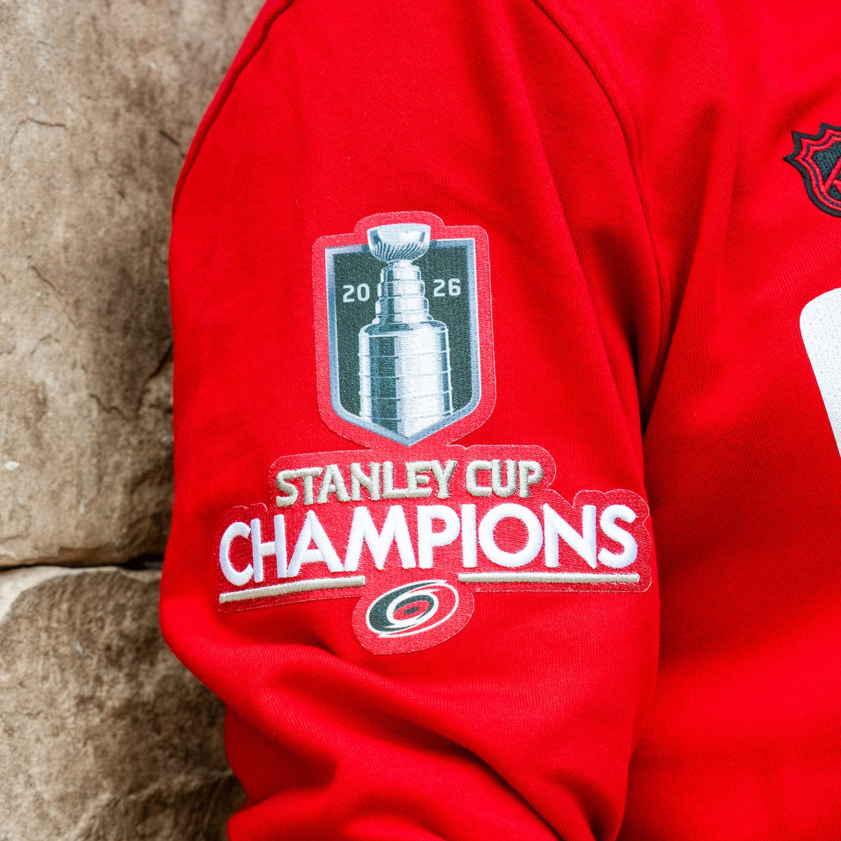 Close up of 2026 Stanley Cup Champions logo patch on right sleeve